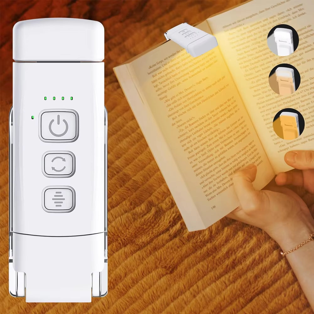 Clip-on book light attached to top of book with person reading.