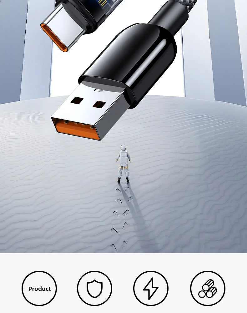 Close-up of a USB cable with a person walking in the desert on a white background