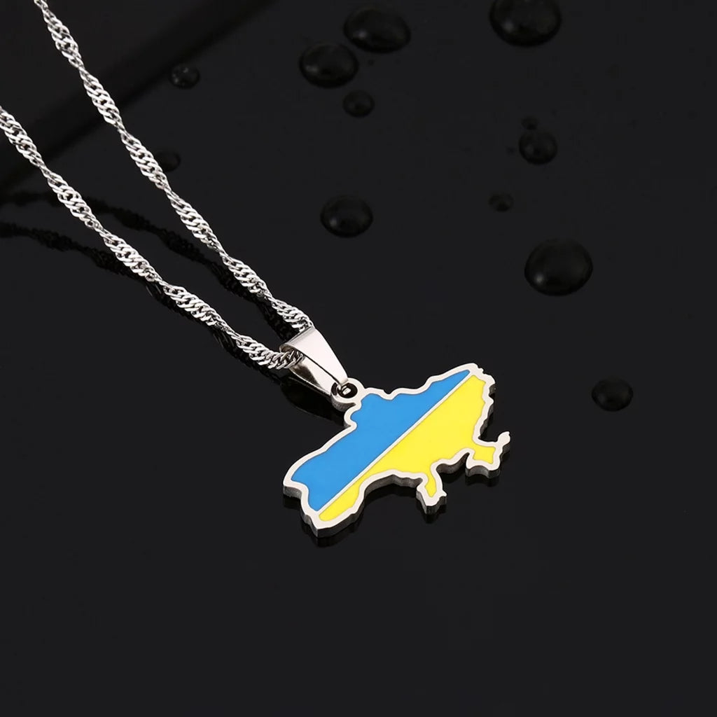 Ukrainian Solidarity Symbol Map Pendant Necklace extreme close-up in water droplets highlighting it's rust resistant material composition.