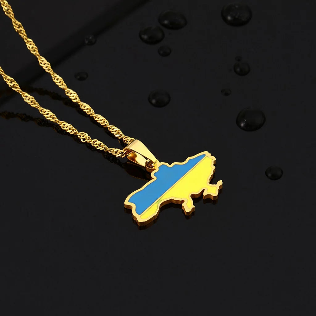 Ukrainian Solidarity Symbol Map Pendant Necklace shown in gold color option over black background with water drops to the side of the jewelry.