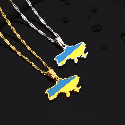 Two Ukrainian solidarity symbol map pendant necklaces, one in gold and the other in silver, each with a pendant shaped like the map of Ukraine.