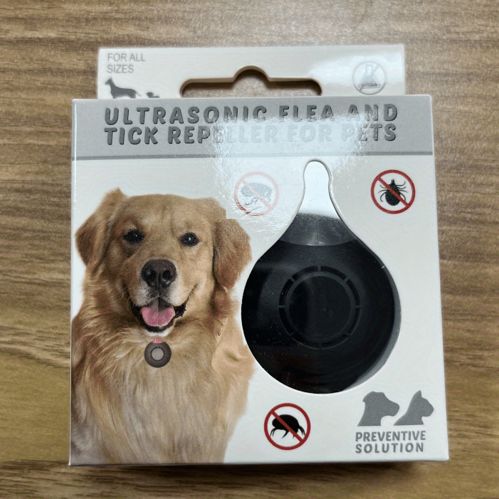 Ultrasonic flea and tick repellent for pets packaging on a wooden surface