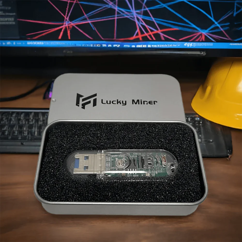 Lucky Miner hardware device in a box with a computer in the background