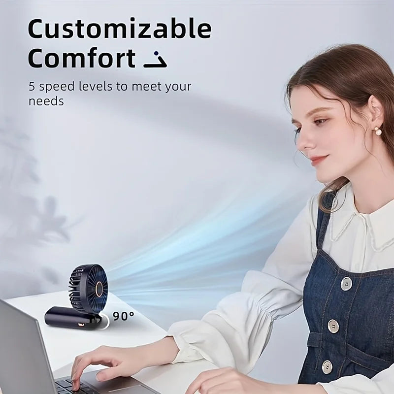 woman using a laptop with a small fan on a desk, showcasing customizable comfort and speed levels as well as fan range and cooling power.