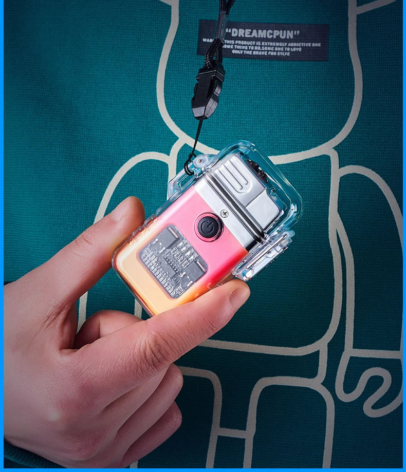 Hand holding a small pink and clear torch lighter from lanyard hung around neck over t-shirt.