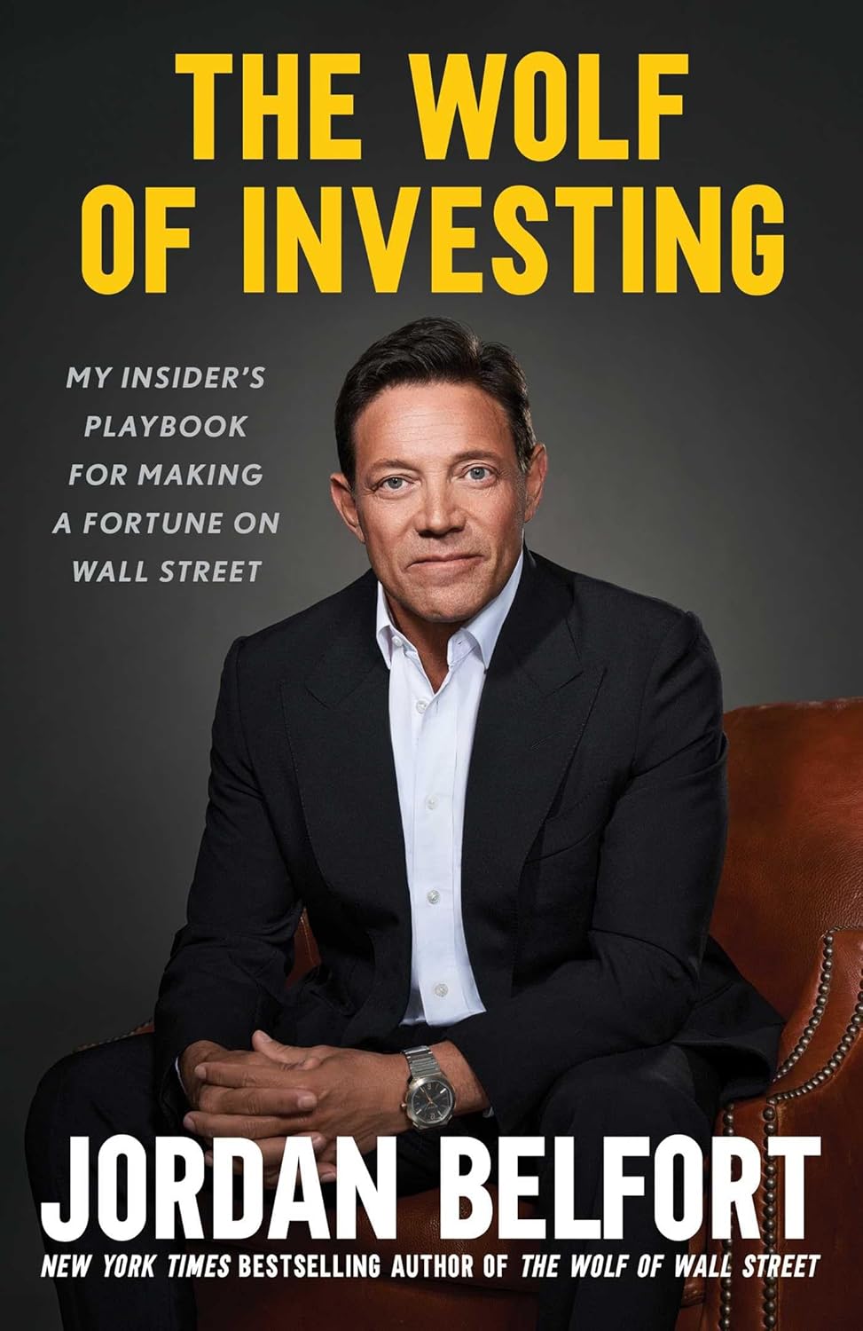 Book cover of 'The Wolf of Investing' by Jordan Belfort with a man in a suit.
