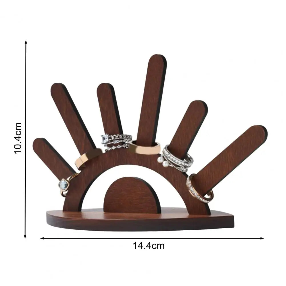 Wooden ring holder with rings on a white background