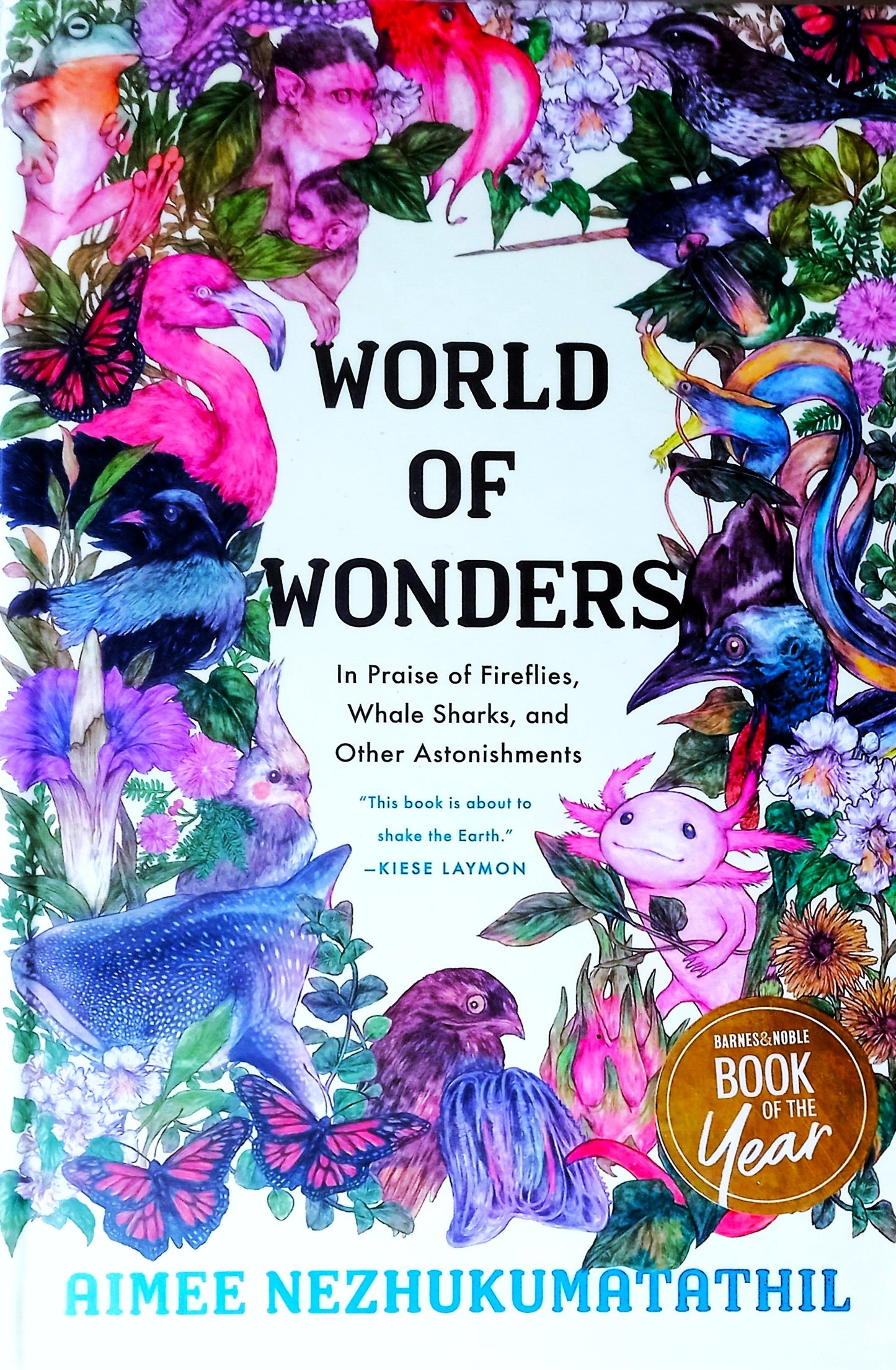 Book cover of 'World of Wonders' with colorful illustrations of animals and nature.